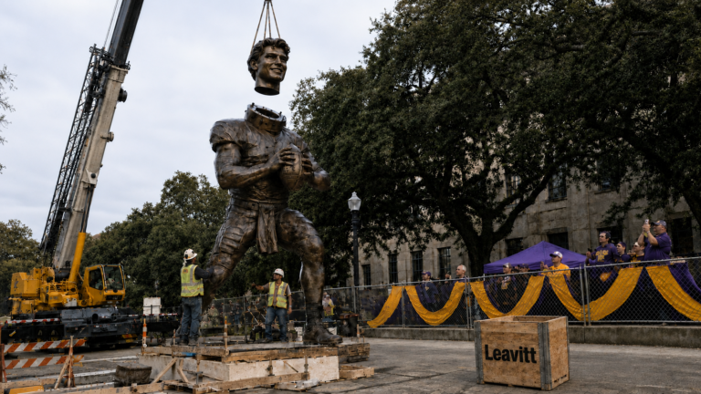 LSU Officials Put Finishing Touches On Sam Leavitt Statue With Removable Head